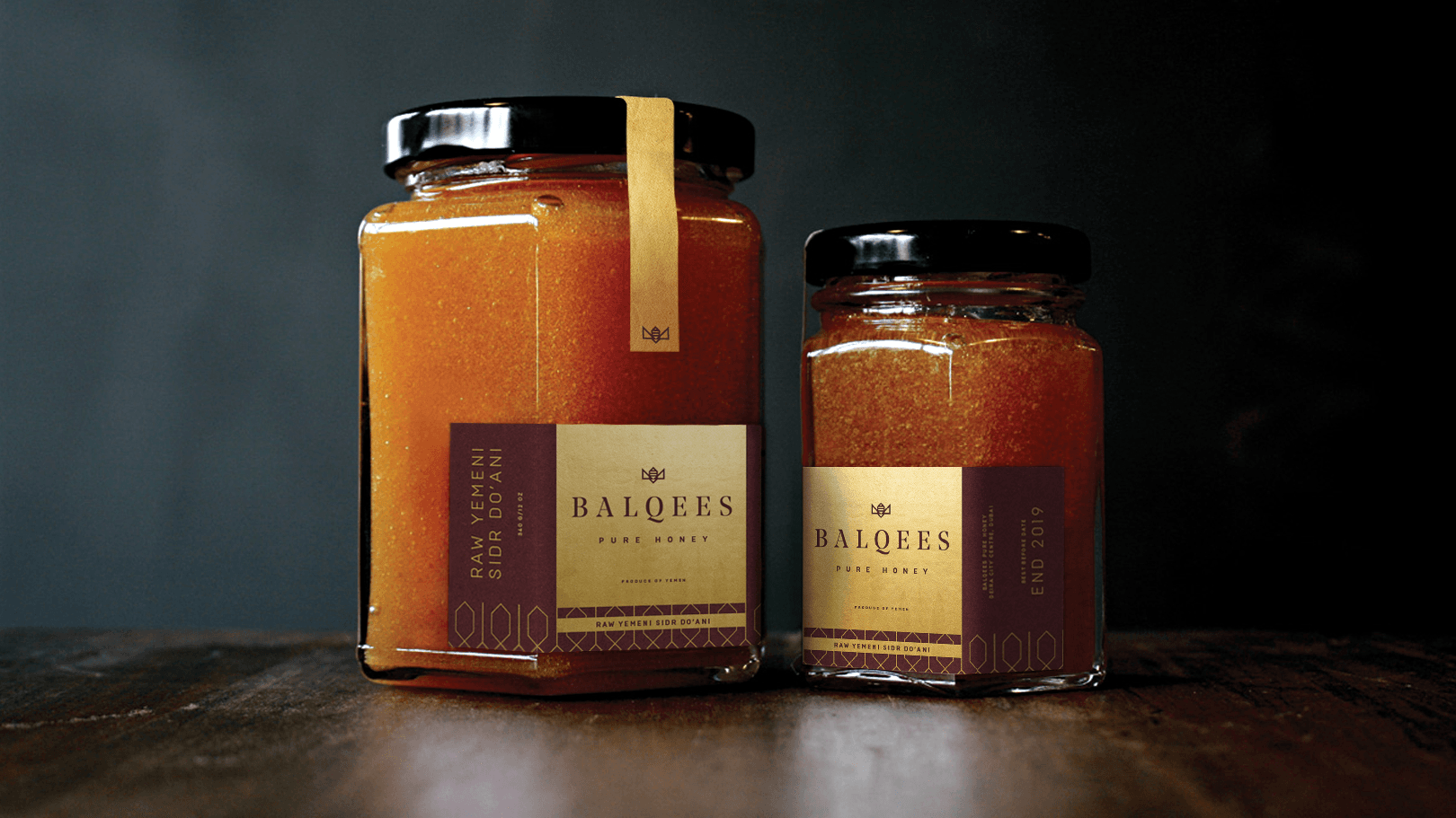 Balqees honey jars with gold labels and black lids