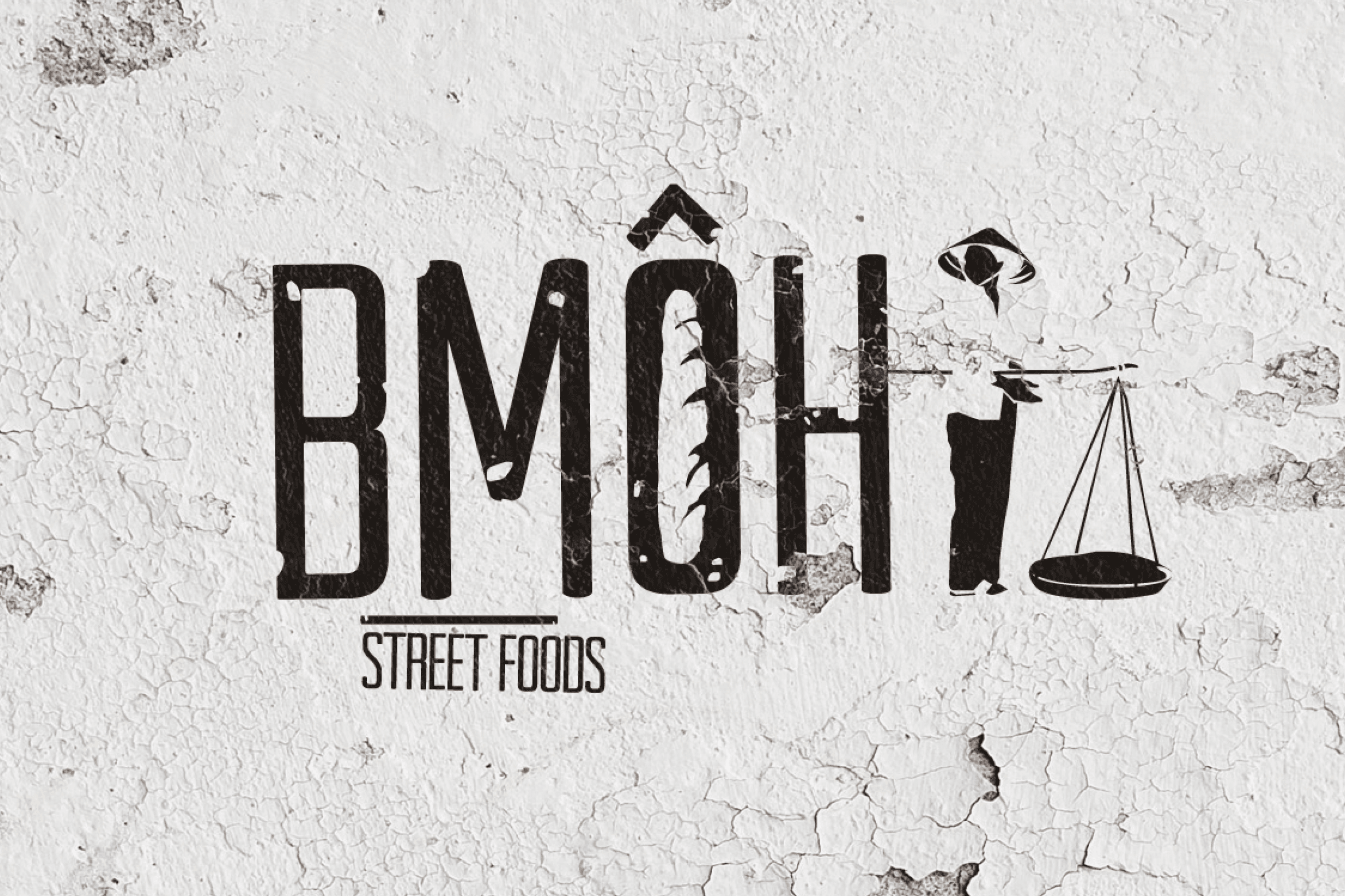 BMÔH Street Foods stencilled logo on a textured wall